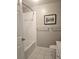 Bathroom with a shower/tub combo and tile throughout at 5711 Bentgrass Dr # 19-203, Sarasota, FL 34235