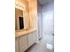Bathroom featuring double sinks with tiled floors, and a bathtub with shower in view at 5711 Bentgrass Dr # 19-203, Sarasota, FL 34235