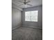 Inviting bedroom with a serene ambiance and window for natural light at 5711 Bentgrass Dr # 19-203, Sarasota, FL 34235