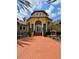 Community center with a grand entrance, well-maintained landscaping, and clear signage at 5711 Bentgrass Dr # 19-203, Sarasota, FL 34235