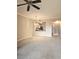 Open-concept living area offering a pass-through to the kitchen, neutral colors, and a cozy atmosphere at 5711 Bentgrass Dr # 19-203, Sarasota, FL 34235