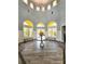 Elegant lobby featuring high ceilings, large windows, and stylish decor at 5711 Bentgrass Dr # 19-203, Sarasota, FL 34235