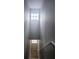 Stairwell offering natural light, with two windows offering light from above at 5711 Bentgrass Dr # 19-203, Sarasota, FL 34235