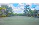 Enjoy a match on this well-maintained court surrounded by lush greenery and scenic views at 5711 Bentgrass Dr # 19-203, Sarasota, FL 34235