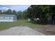 Expansive backyard featuring a shed and lots of greenery, perfect for outdoor activities at 6238 Angus Valley Dr, Wesley Chapel, FL 33544