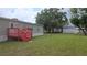 Expansive backyard with a deck and lush green lawn, perfect for entertaining at 6238 Angus Valley Dr, Wesley Chapel, FL 33544