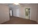 Bedroom with carpeting and an ensuite bathroom visible through the doorway at 6238 Angus Valley Dr, Wesley Chapel, FL 33544