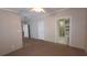Bedroom with carpeting and an ensuite bathroom visible through the doorway at 6238 Angus Valley Dr, Wesley Chapel, FL 33544