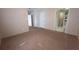 Bedroom with neutral walls and doorway leading to ensuite bathroom at 6238 Angus Valley Dr, Wesley Chapel, FL 33544