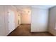 A carpeted bedroom with neutral walls and a ceiling fan; a bathroom is accessible at 6238 Angus Valley Dr, Wesley Chapel, FL 33544