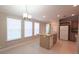 Bright kitchen featuring an island with a sink, wood cabinets, and natural light at 6238 Angus Valley Dr, Wesley Chapel, FL 33544