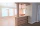 Open floor plan with half wall that connects living room to kitchen at 6238 Angus Valley Dr, Wesley Chapel, FL 33544