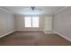 Inviting living room with neutral carpet and natural light at 6238 Angus Valley Dr, Wesley Chapel, FL 33544
