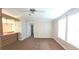 Spacious living room with neutral carpet and natural light from large windows at 6238 Angus Valley Dr, Wesley Chapel, FL 33544