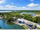 Aerial view of waterfront property with lush greenery and lake access at 6406 Lincoln Rd, Bradenton, FL 34203