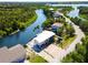 Waterfront home with a lush backyard and convenient driveway access at 6406 Lincoln Rd, Bradenton, FL 34203