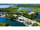Aerial view showcasing waterfront property with lush landscaping and community waterways at 6406 Lincoln Rd, Bradenton, FL 34203