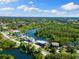Aerial view featuring waterfront property with beautiful waterway access and lush surroundings at 6406 Lincoln Rd, Bradenton, FL 34203
