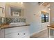 Bathroom with white vanity, rustic wood counter, and mosaic tile backsplash at 6406 Lincoln Rd, Bradenton, FL 34203