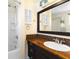 Bathroom with a shower and a dark vanity at 6406 Lincoln Rd, Bradenton, FL 34203