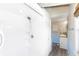 Clean bathroom featuring a white shower stall, wood paneled wall and sink at 6406 Lincoln Rd, Bradenton, FL 34203