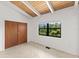 Bedroom featuring vaulted ceilings, tile flooring and a view to the water at 6406 Lincoln Rd, Bradenton, FL 34203