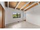 Bedroom featuring vaulted ceilings, tile flooring and a window with a water view at 6406 Lincoln Rd, Bradenton, FL 34203