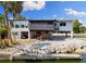 Waterfront home featuring a balcony and screened porch at 6406 Lincoln Rd, Bradenton, FL 34203