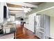 Well-equipped kitchen with stainless steel appliances, hardwood floors, and a seamless flow into the living area at 6406 Lincoln Rd, Bradenton, FL 34203
