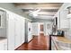 Well-lit kitchen with white cabinets, stainless appliances, and hardwood floors at 6406 Lincoln Rd, Bradenton, FL 34203