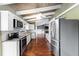 Well-appointed kitchen featuring stainless steel appliances, ample cabinetry, and hardwood floors at 6406 Lincoln Rd, Bradenton, FL 34203