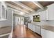Bright kitchen with white cabinets, stainless appliances, wood ceiling and beams at 6406 Lincoln Rd, Bradenton, FL 34203