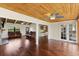 Open-concept living room features hardwood floors and ceiling fans at 6406 Lincoln Rd, Bradenton, FL 34203