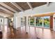 Open floor plan with hardwood floors connecting living room and kitchen, highlighting water views at 6406 Lincoln Rd, Bradenton, FL 34203