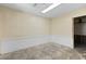 Unfinished room with beige walls and white trim, ready for personalization at 6406 Lincoln Rd, Bradenton, FL 34203