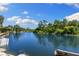 Beautiful waterfront views of this community on a bright day with lush trees and blue skies at 6406 Lincoln Rd, Bradenton, FL 34203
