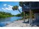 Waterfront view of the canal and the side of the home at 6406 Lincoln Rd, Bradenton, FL 34203