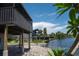 View of the canal behind the home, showing the supports and the waterfront location at 6406 Lincoln Rd, Bradenton, FL 34203