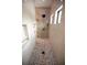 Modern bathroom features a glass enclosed shower with stone tile flooring and custom built in storage at 6713 Taneytown St, North Port, FL 34291