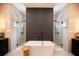 Bright and modern bathroom featuring a freestanding tub and separate glass-enclosed showers at 6713 Taneytown St, North Port, FL 34291