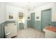 Bedroom with soft blue wainscoting, a crib, changing table, and natural light, ideal for a baby at 6713 Taneytown St, North Port, FL 34291