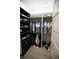 Walk-in closet with custom shelving, hanging rods, and ample storage for clothes and shoes at 6713 Taneytown St, North Port, FL 34291
