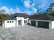 Attractive home with a well-manicured lawn and a three-car garage at 6713 Taneytown St, North Port, FL 34291