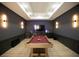 A recreational room with a pool table, custom lighting and entertainment center; perfect for hosting! at 6713 Taneytown St, North Port, FL 34291