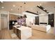 Modern kitchen with large island, bar seating, and stainless steel appliances at 6713 Taneytown St, North Port, FL 34291