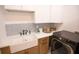 Functional laundry space with modern washer, dryer, and ample counter space at 6713 Taneytown St, North Port, FL 34291
