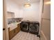 Well-equipped laundry room featuring modern appliances and stylish fixtures at 6713 Taneytown St, North Port, FL 34291