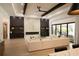 Bright living room boasts hardwood floors, marble fireplace, and neutral decor at 6713 Taneytown St, North Port, FL 34291