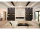 Stunning living room with dark wood beams, marble fireplace, and open layout at 6713 Taneytown St, North Port, FL 34291