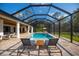 Inviting screened-in pool and patio area with ample seating for guests and entertaining at 6713 Taneytown St, North Port, FL 34291